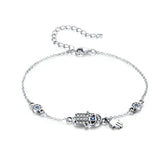 Bracelet Hamsa en argent 925 plaqué or blanc ajustable avec zircons blancs et bleus