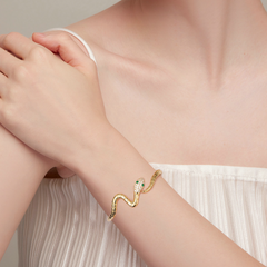 Bracelet Serpent Jonc en acier inoxydable plaqué or jaune avec pavé de zircons blancs et verts - Photo 2