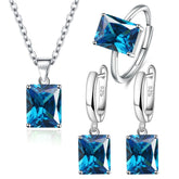 Parure de Bijoux Argent Sterling 925 plaqué or blanc avec collier, boucles d’oreilles et bague ajustable avec zircons bleus