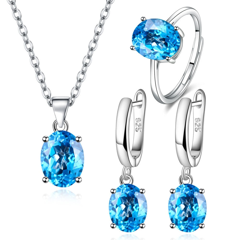 Parure de Bijoux Argent Sterling 925 plaqué or blanc avec collier, boucles d’oreilles et bague ajustable avec zircons bleus