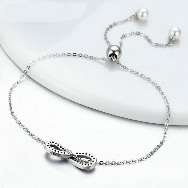 Bracelet Infini en argent 925 plaqué or blanc ajustable avec zircons blancs et perles - Photo 4