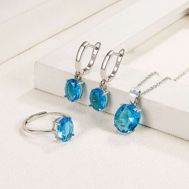 Parure de Bijoux Argent Sterling 925 plaqué or blanc avec collier, boucles d’oreilles et bague ajustable avec zircons bleus - Photo 2